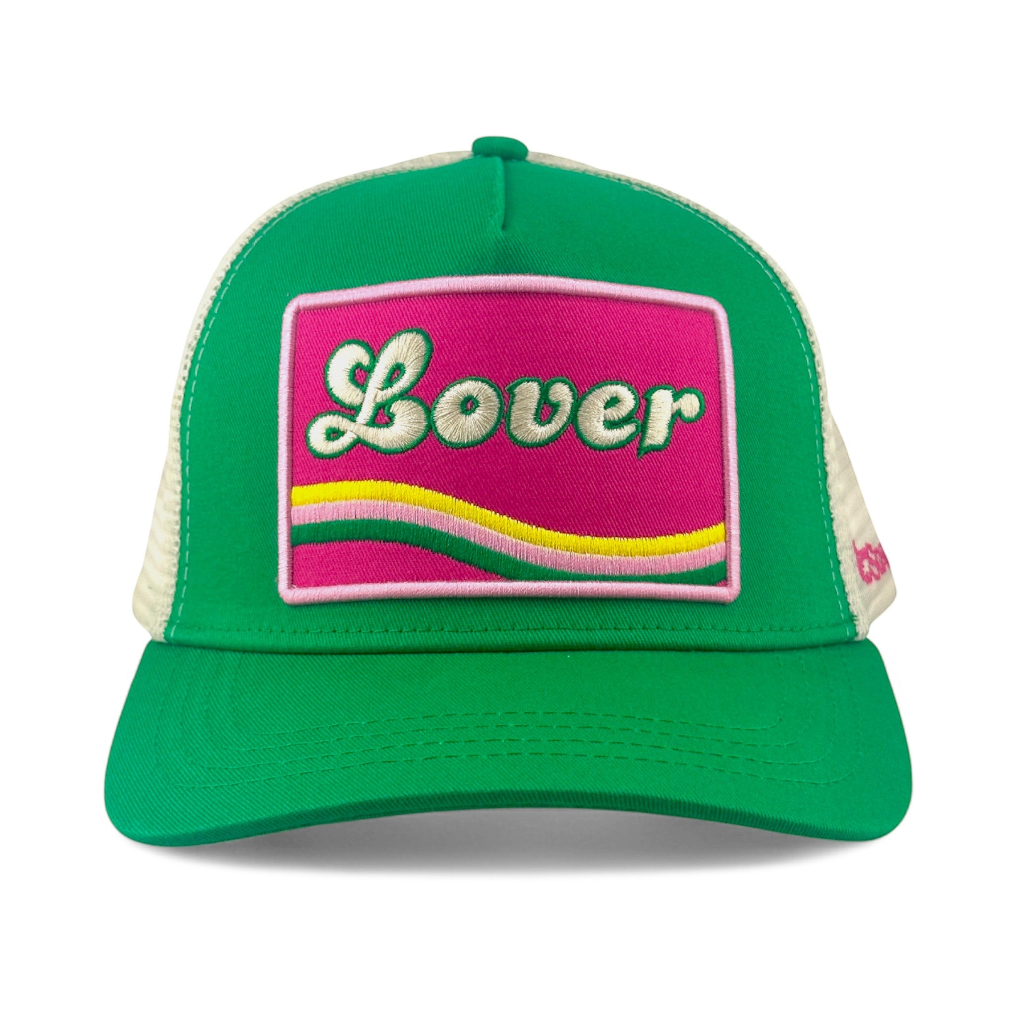Soulbyrd Wholesale green 5-panel trucker hat with a pink patch featuring the word Lover in white script embroidery.