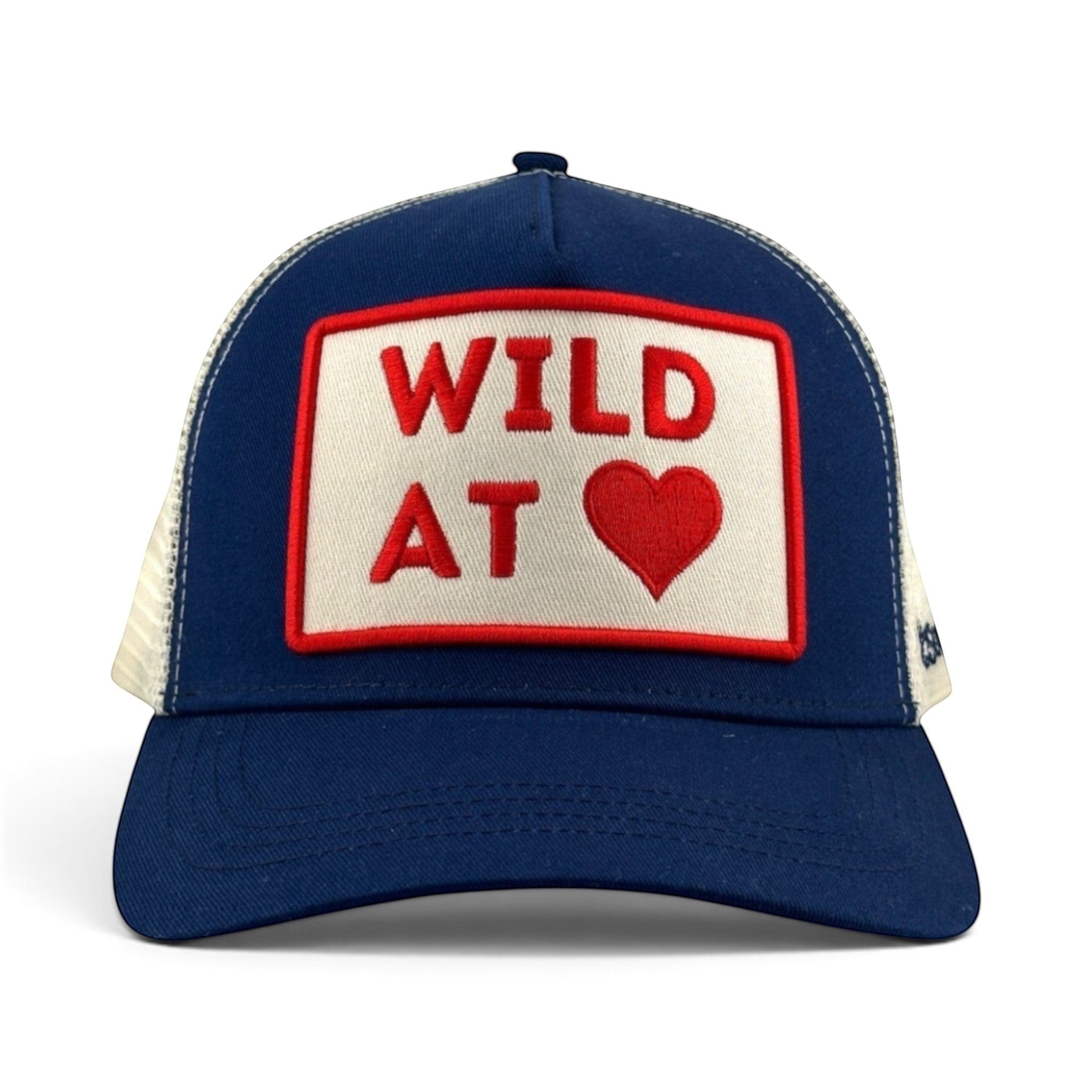 Soulbyrd Wholesale navy trucker hat with white mesh back and Wild At Heart embroidered patch on cotton twill front