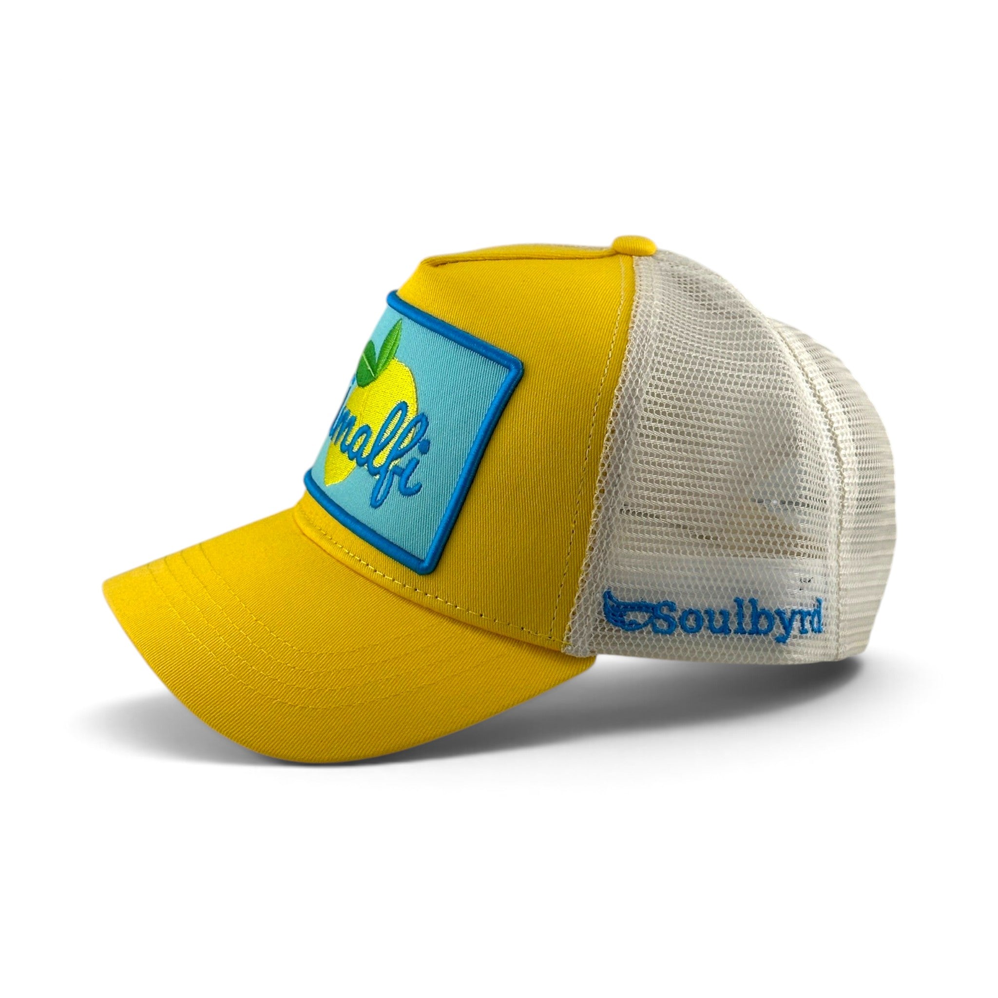 Soulbyrd Wholesale Amalfi yellow cotton trucker hat with white mesh back and blue lemon patch side profile view