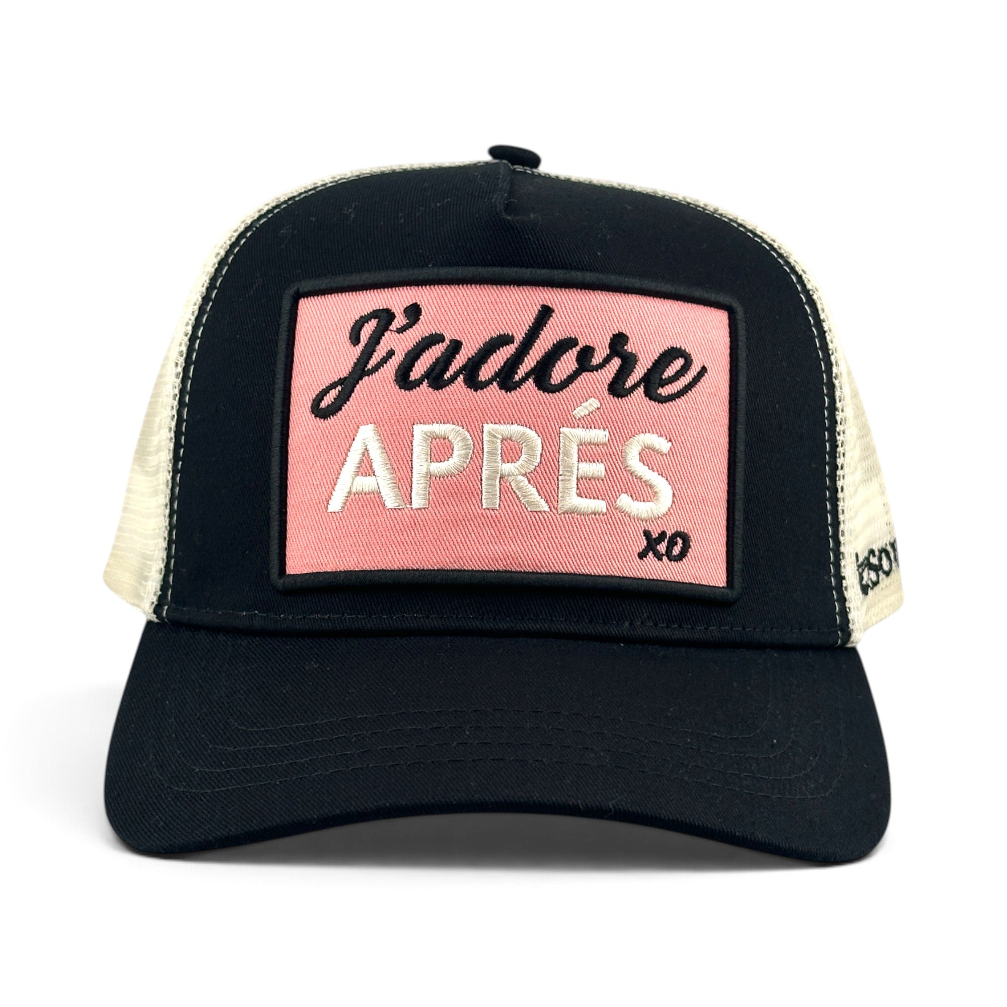 Soulbyrd Wholesale black trucker hat with a pink rectangular patch featuring J'adore APRÉS text and mesh back.