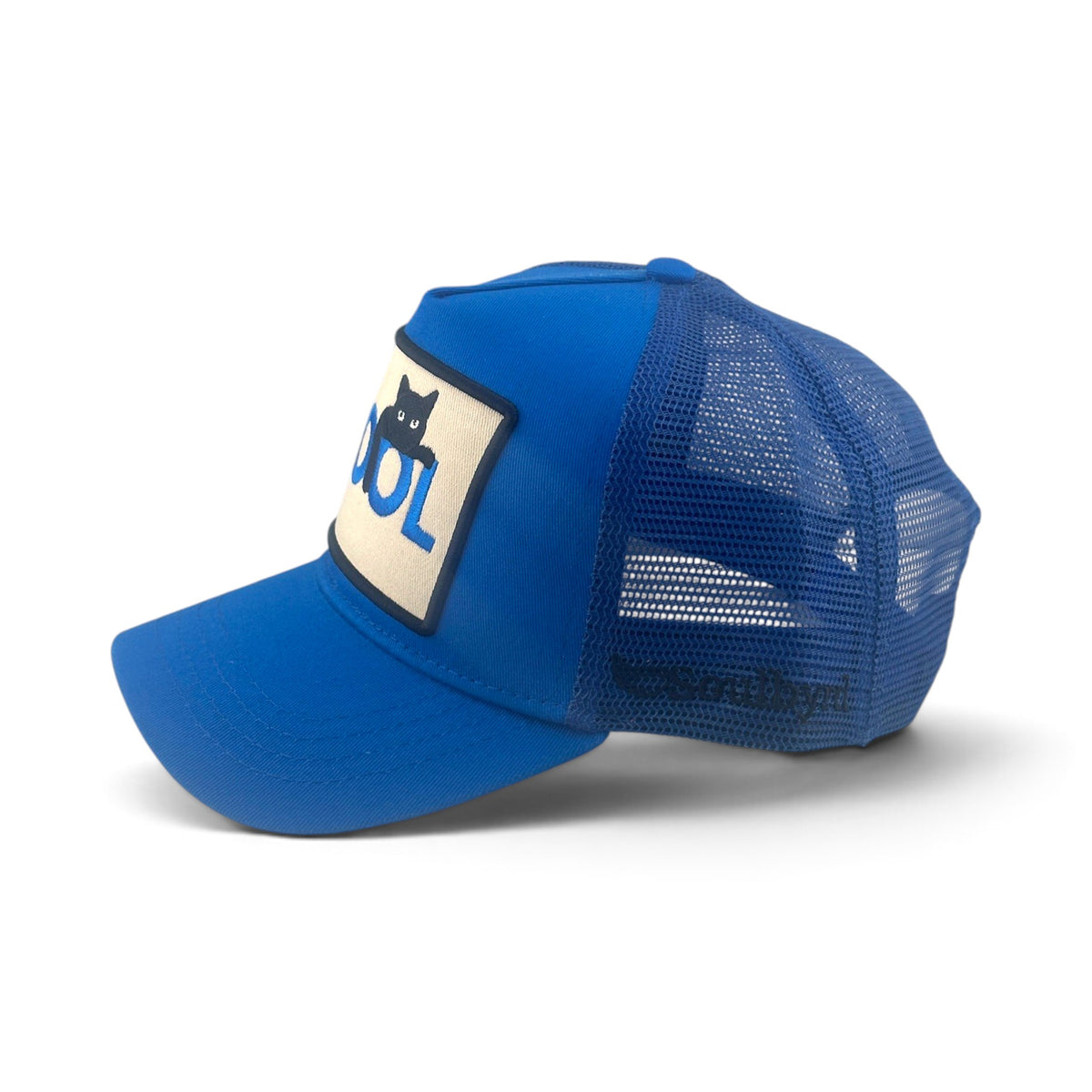 Soulbyrd Wholesale blue 5-panel trucker hat with cotton twill front, nylon mesh back, and Cool Cat patch detail.