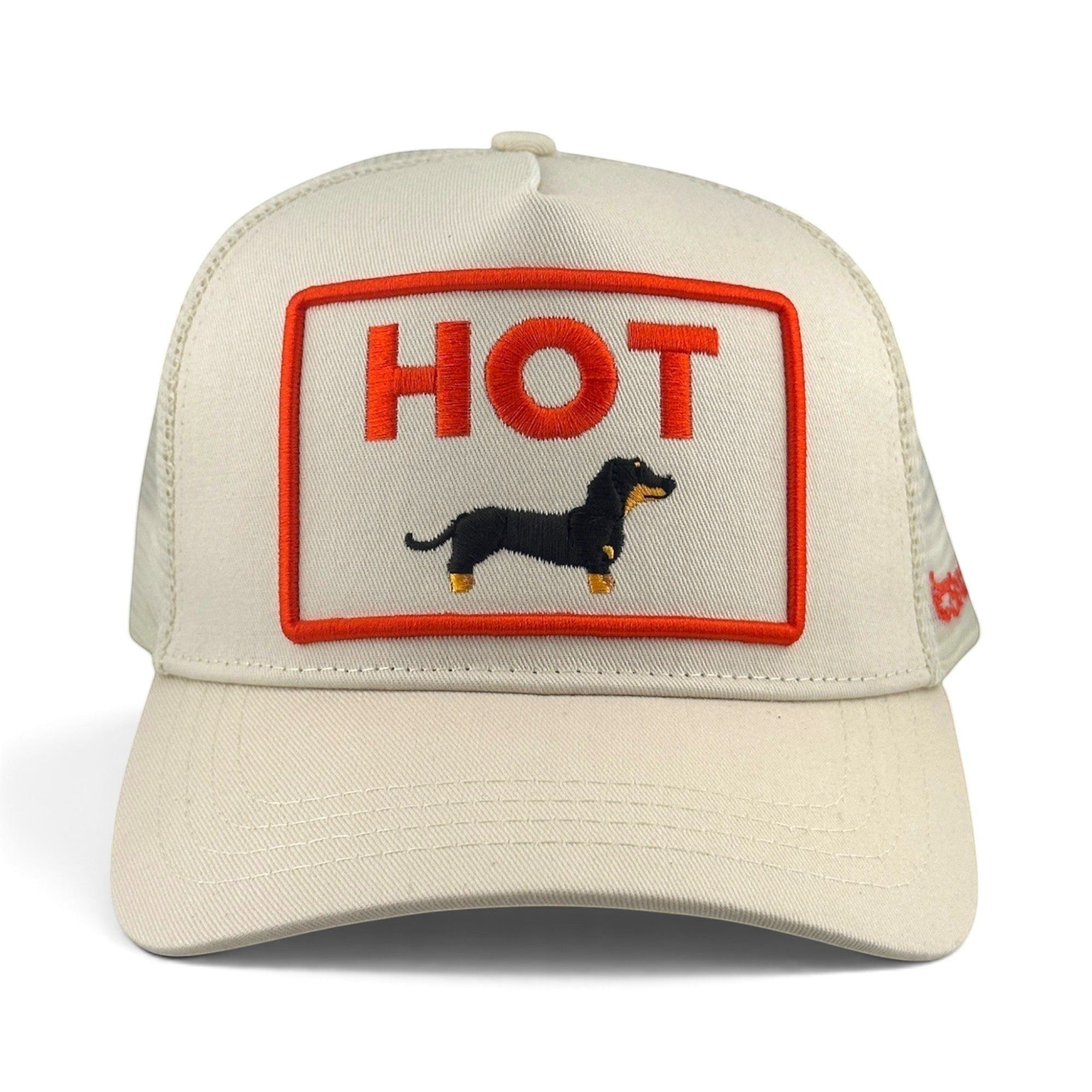 Soulbyrd Wholesale cream trucker hat with a 5-panel cotton twill crown and an embroidered hot dog dachshund patch.