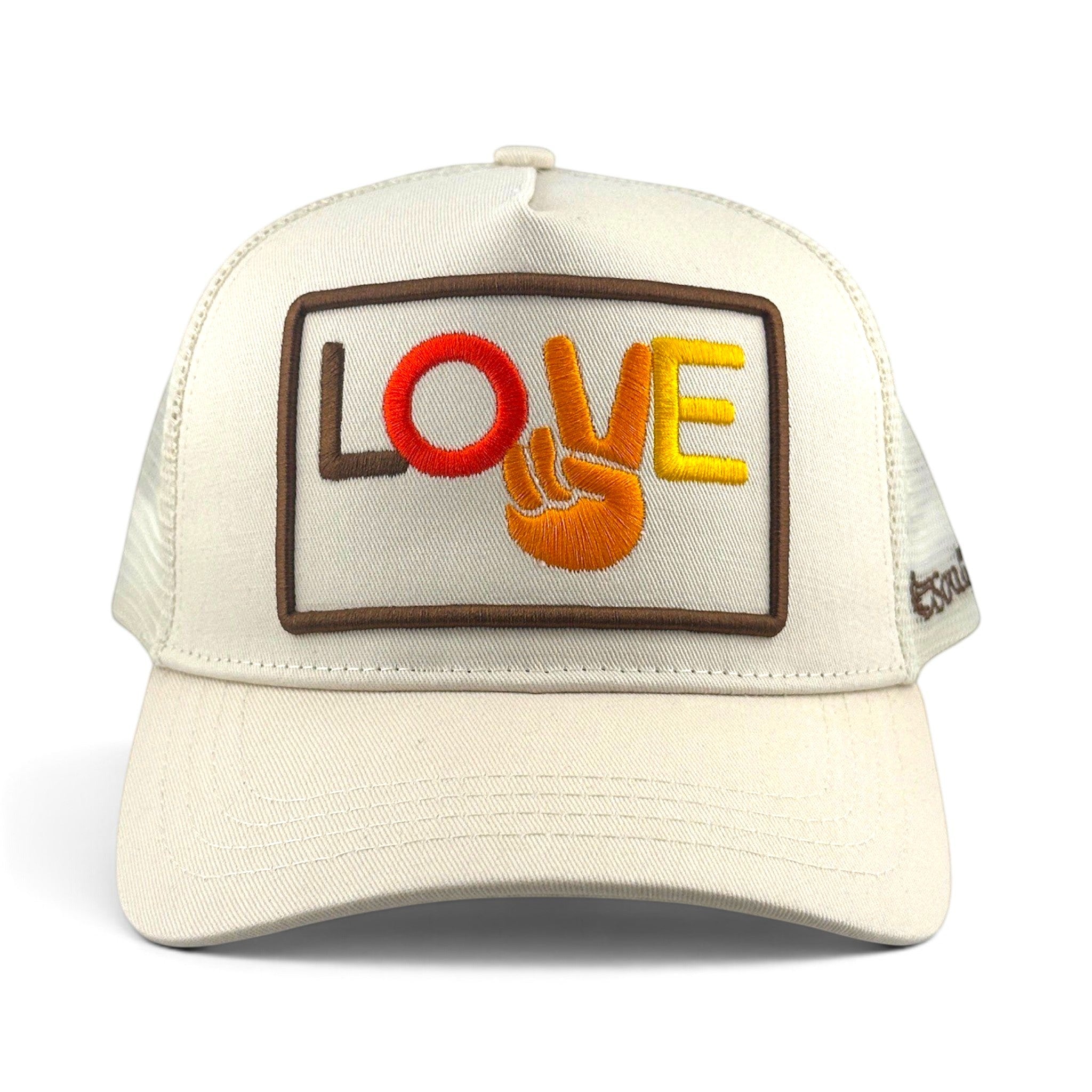 Soulbyrd Wholesale cream trucker hat with Love and peace sign embroidery on a 5-panel cotton and nylon mesh design.
