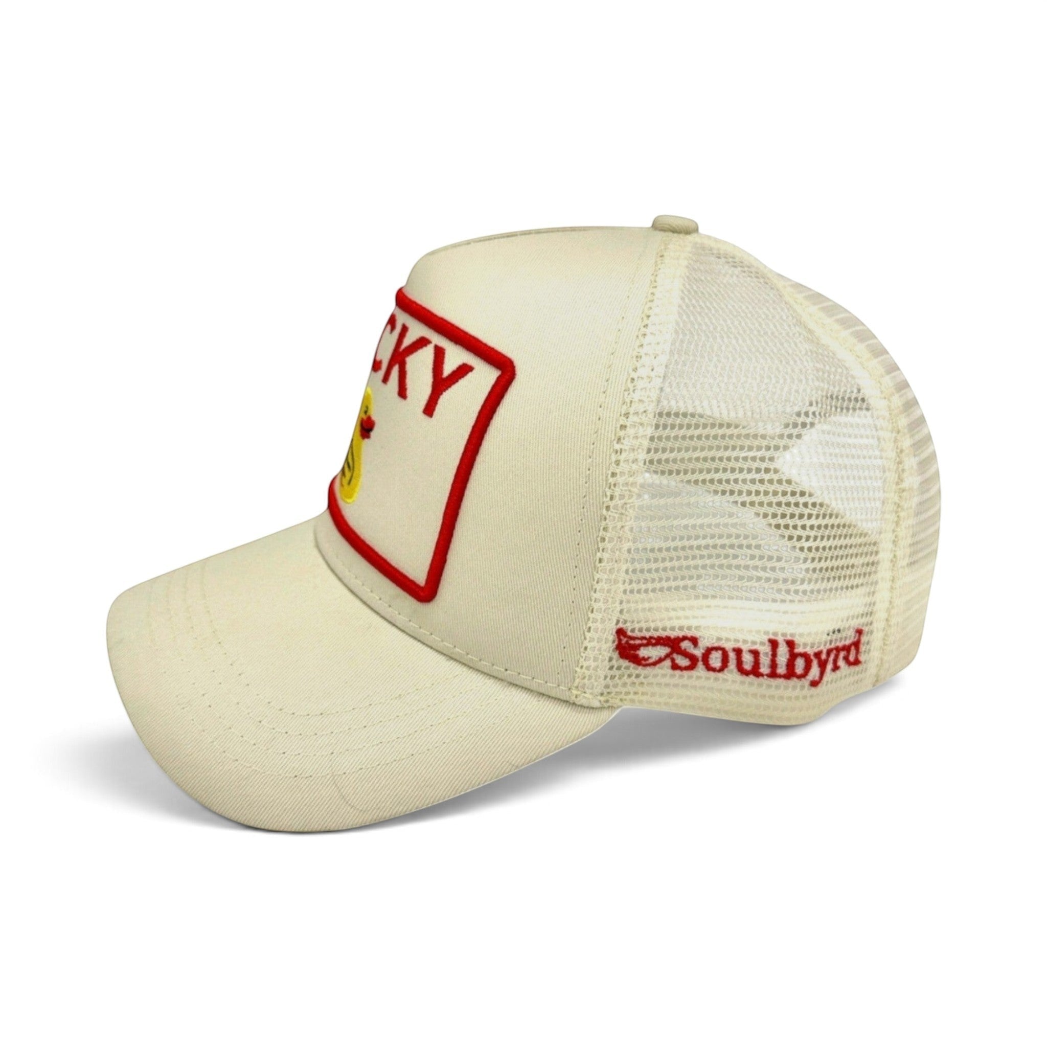 Soulbyrd Wholesale cream trucker hat with Lucky Duck patch, cotton twill front, and breathable nylon mesh back.