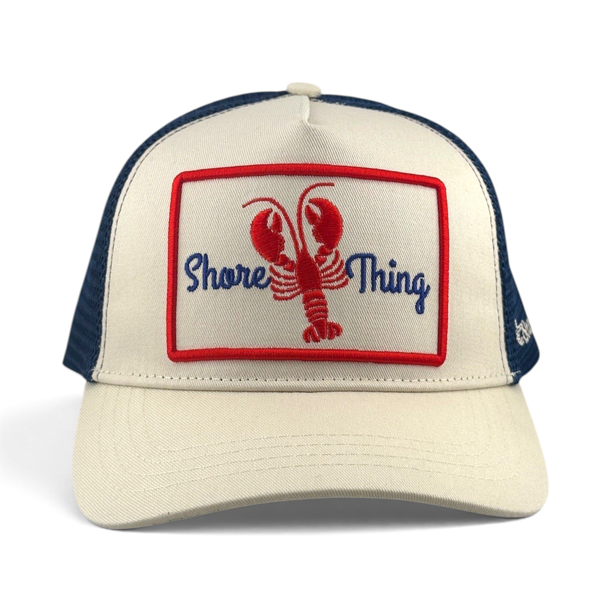 Soulbyrd Wholesale cream and navy trucker hat with a Shore Thing lobster patch on the cotton twill front panel.
