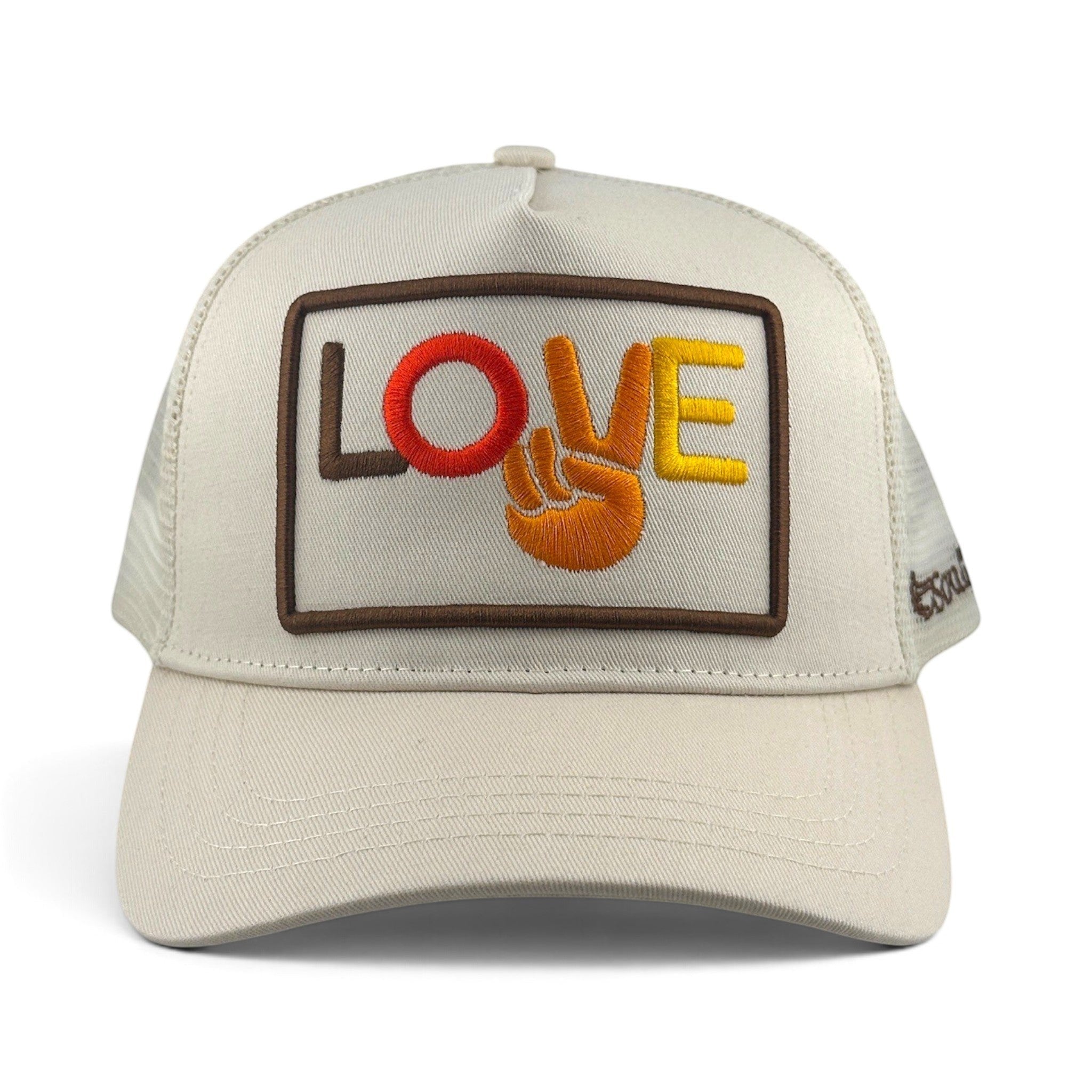 Soulbyrd Wholesale cream trucker hat with Love and Peace sign embroidery on a 5-panel cotton twill and mesh design.