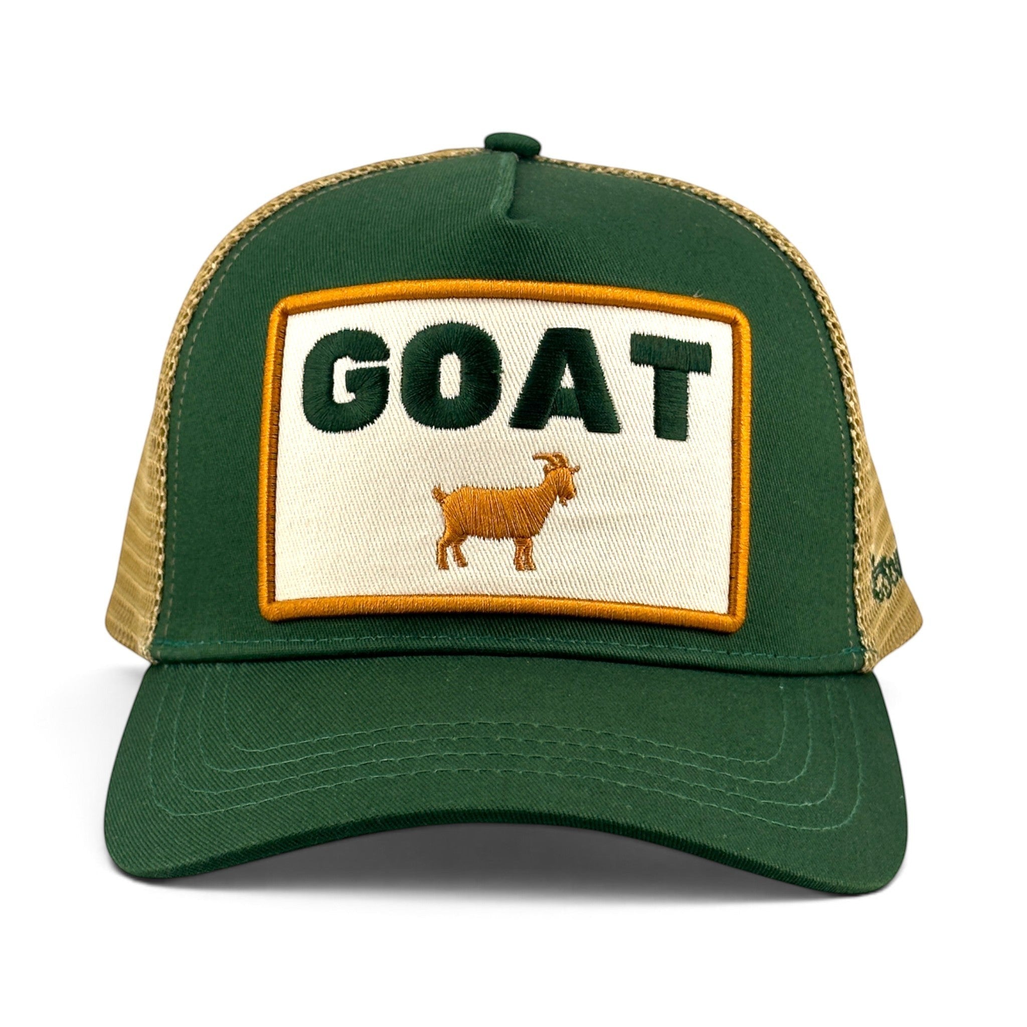 Soulbyrd Wholesale green cotton twill trucker hat with a GOAT patch and tan nylon mesh back, adjustable snapback.