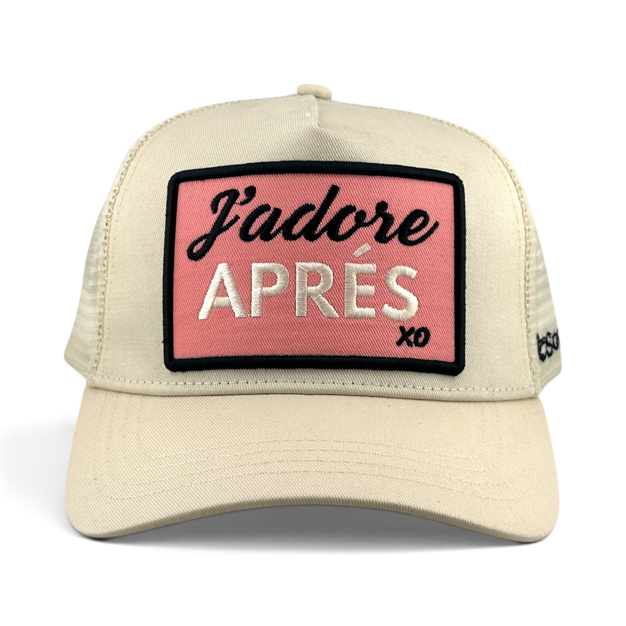 Soulbyrd Wholesale ivory cotton trucker hat with a pink rectangular patch reading J'adore APRÉS in black and white.