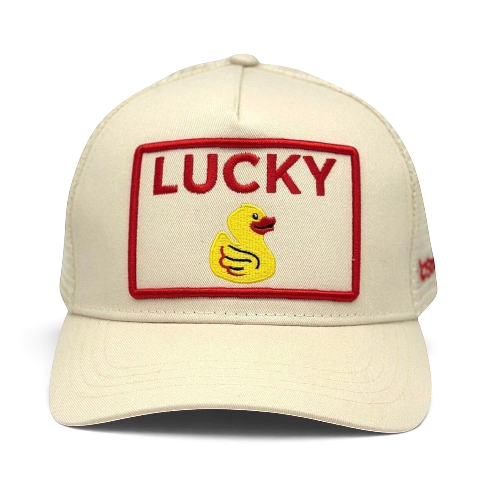 Soulbyrd Wholesale cream 5-panel trucker hat with a Lucky Duck embroidered patch and red border on cotton twill.