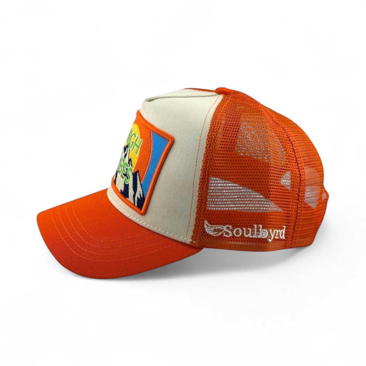 Soulbyrd Wholesale orange and cream trucker hat with High Vibes mountain patch and mesh back, side profile view