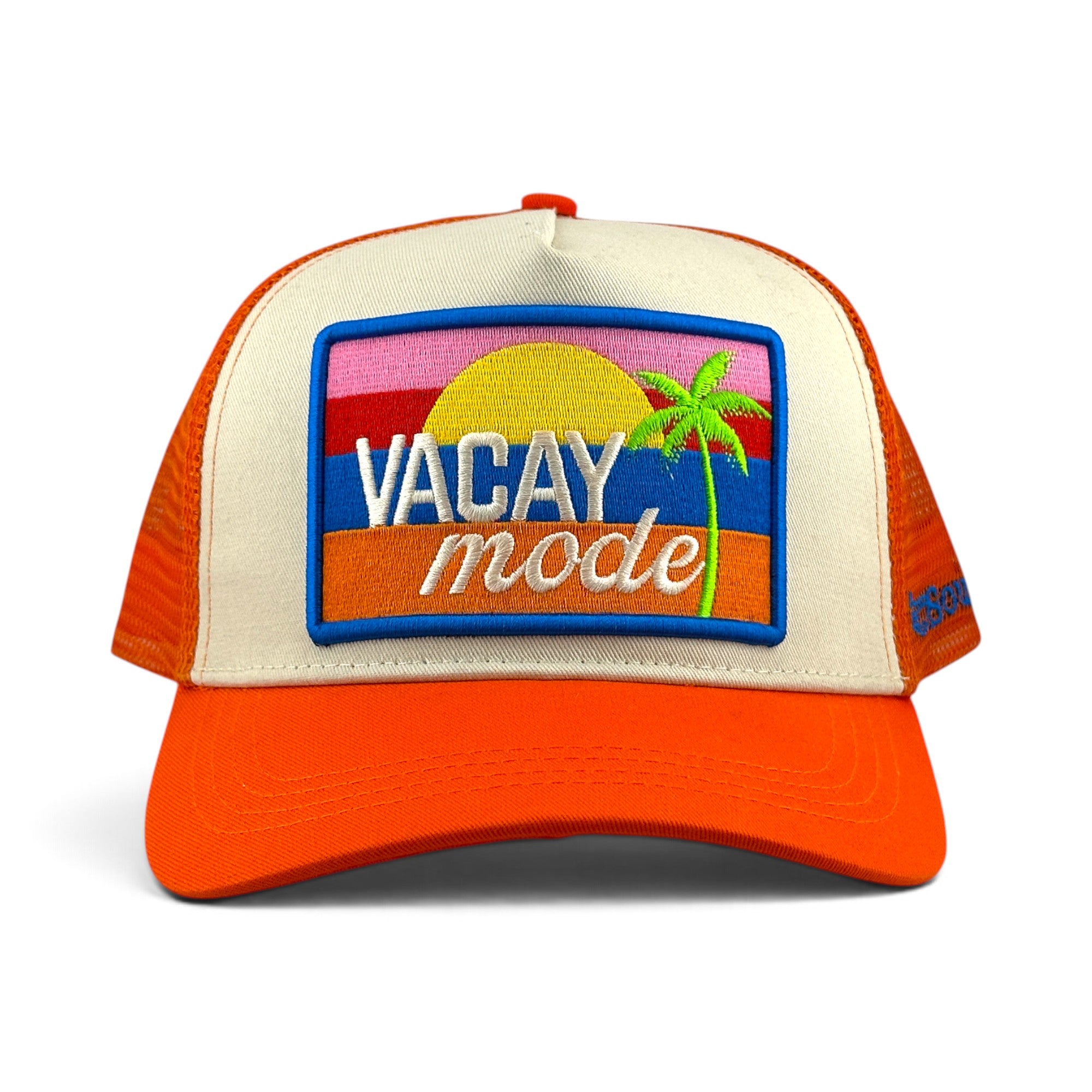 Soulbyrd Wholesale orange and cream trucker hat with a Vacay Mode embroidered patch featuring a sunset and palm tree.