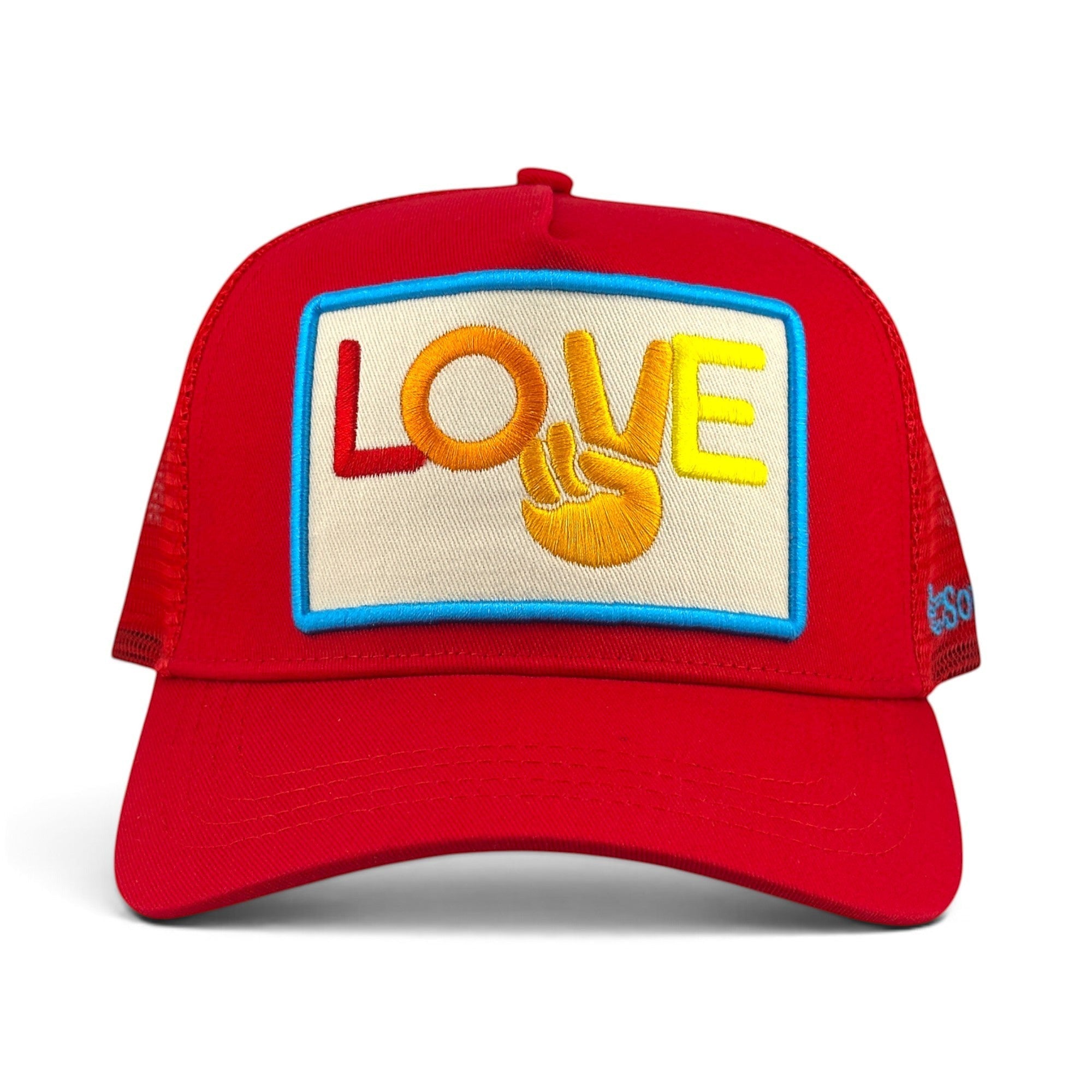 Soulbyrd Wholesale red trucker hat with a cotton twill front and nylon mesh back featuring a colorful LOVE patch