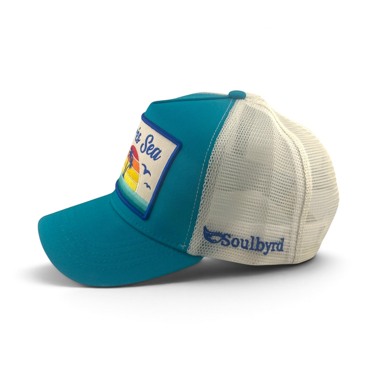 Soulbyrd Wholesale turquoise cotton and white mesh trucker hat with Apres Sea patch and side logo, side view
