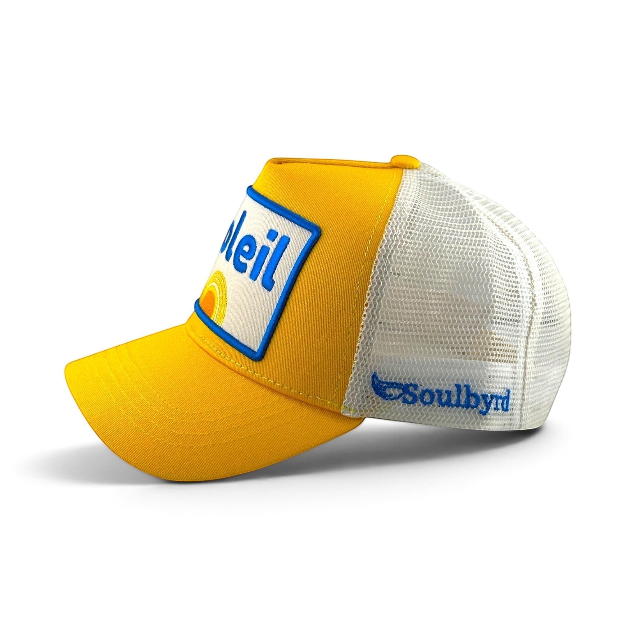 Soulbyrd Wholesale yellow 5-panel trucker hat with white mesh back, cotton twill crown, and Soleil graphic patch.